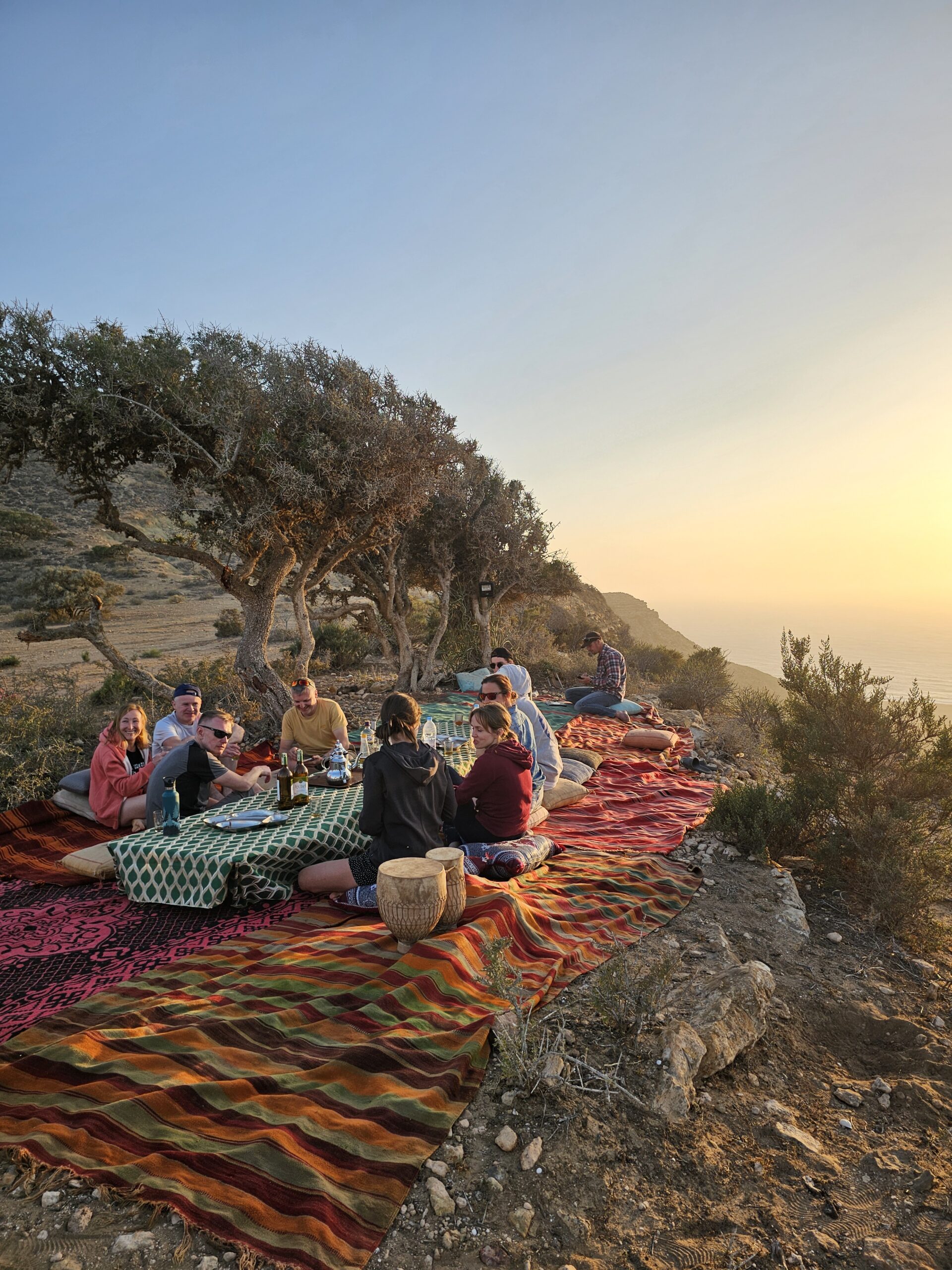Sunset camp dinner overlooking the Atlantic during a horse trek in Morocco